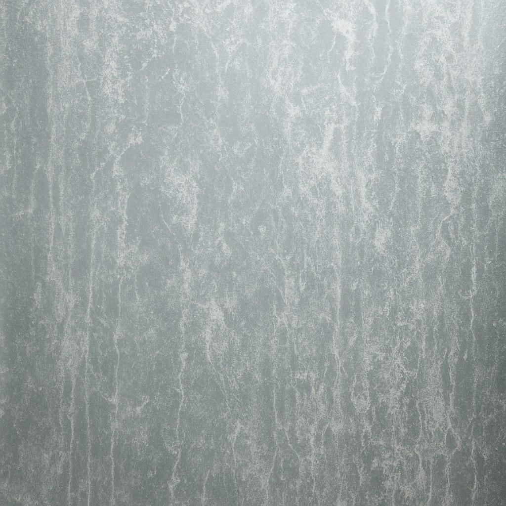 A glass shower door covered in white soap scum buildup.
